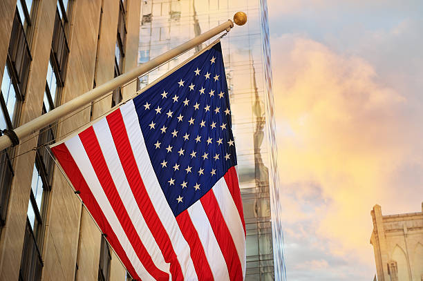 istock American flag and tall buildings in NYC 174999550