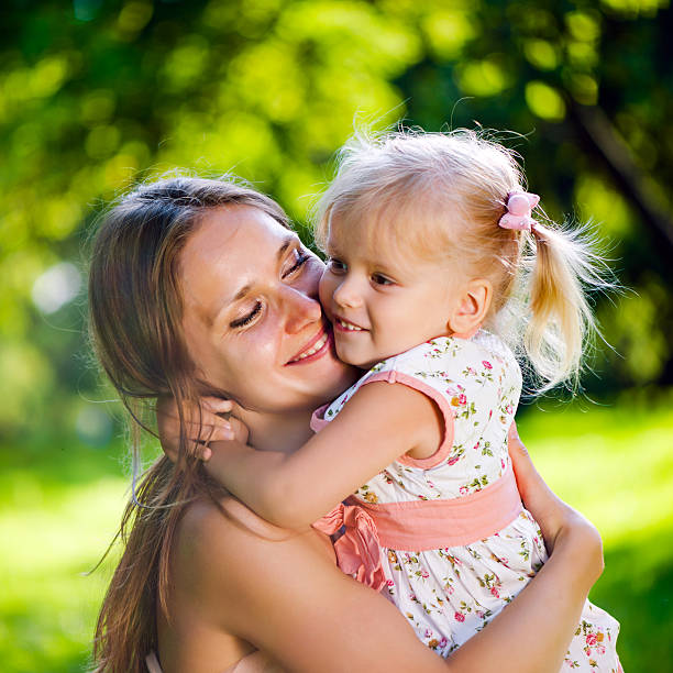 istock Young mother with her daughter in park 174999881