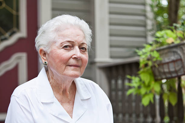 istock Elderly woman in front of home 175000065