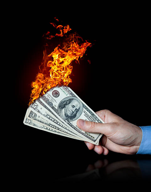 istock Hand holding burning dollars money 175000280