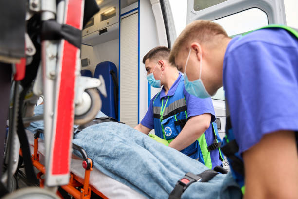 istock Experienced doctors in uniform unload gurney with patient from ambulance 1750005879