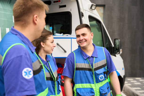 istock Paramedics and a nurse communicate in a parking lot 1750005909