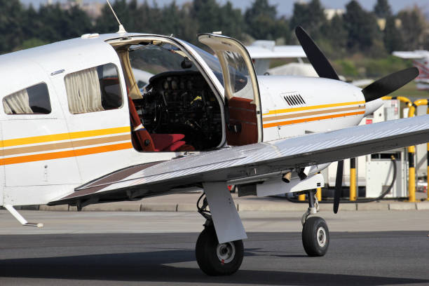 istock light aircraft with open door at airfield 1750024400