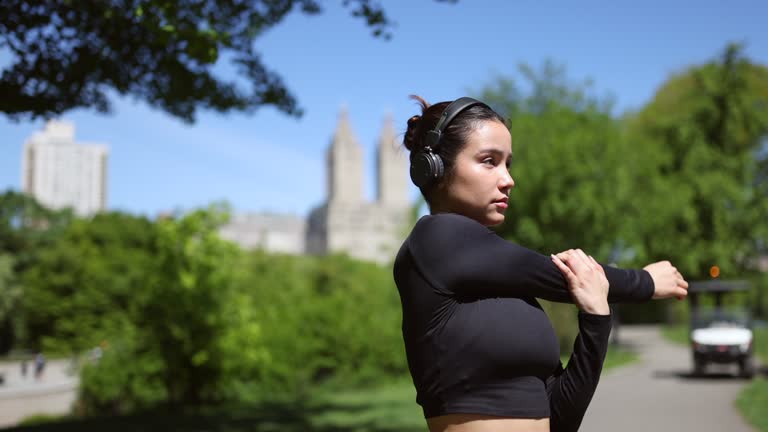 Multiracial girl jogging in Central Park