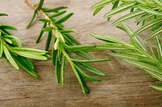 istock fresh rosemary on wooden background 175003459