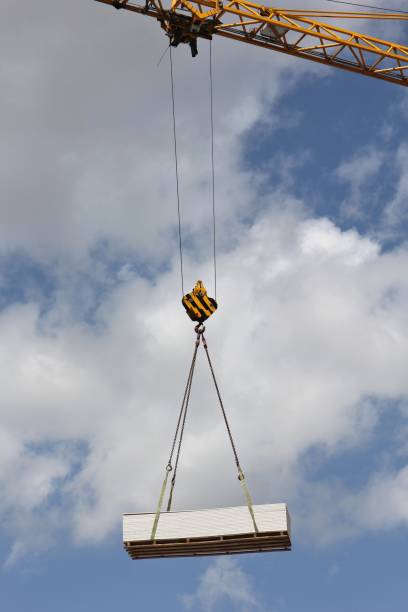 istock pallet of plasterboards at crane hook 1750050249