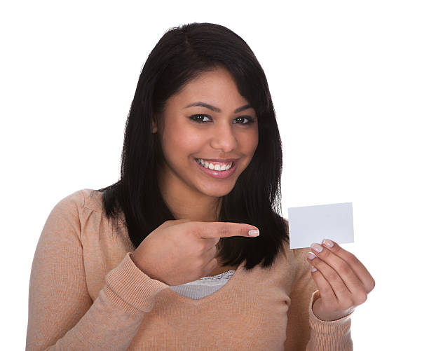 istock Young Woman Pointing At Visiting Card 175005239