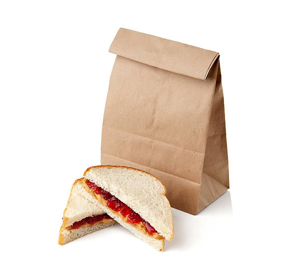 Peanut butter and jelly sandwich on white background.  Please see my portfolio for other food and drink images.