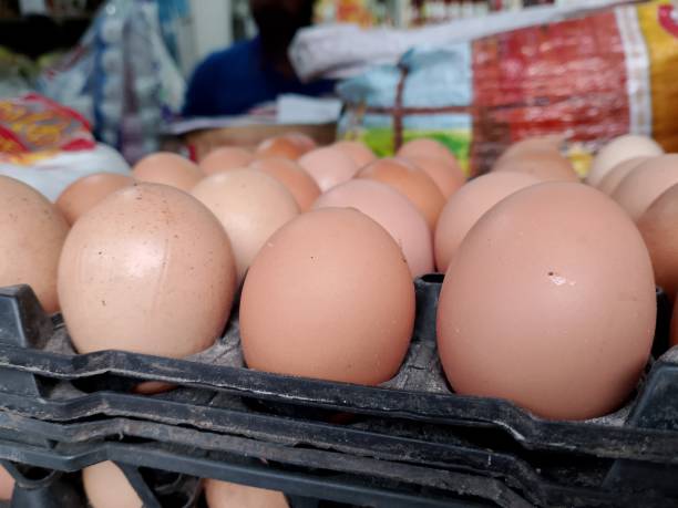 istock Farm chicken eggs in basket at shop 1750062900