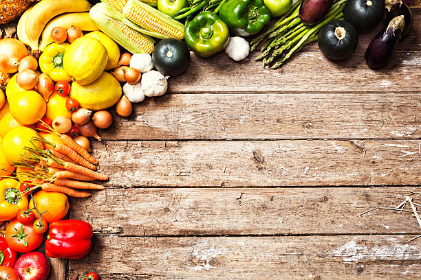 istock Cornucopia of fresh vegetables form border on weathered wood 175006518