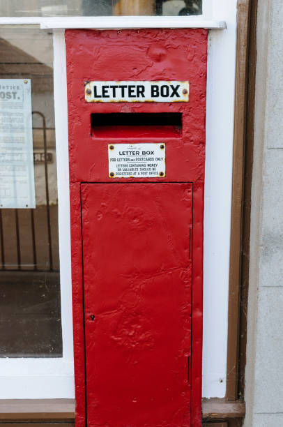 istock Old Irish red letterbox outside a post office 1750079363