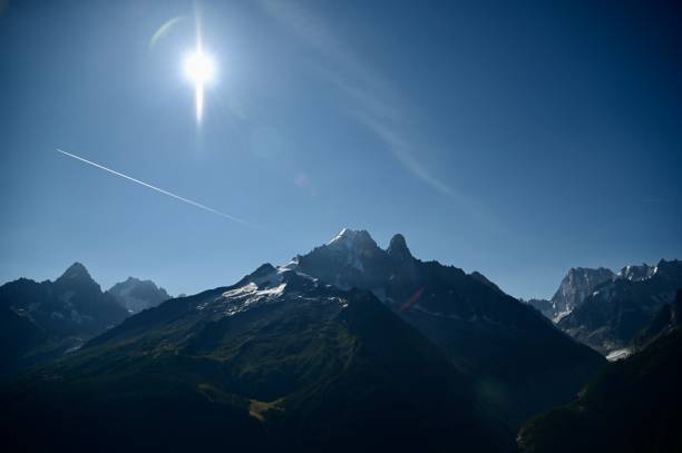 istock Sun and contrail over mountain in the Alps 1750079898