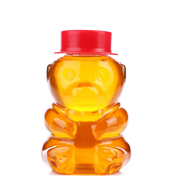 istock Bottle shaped like a bear and filled with honey. 175008535