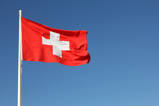 Swiss flag flying in the wind