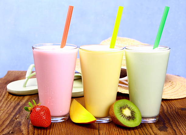 istock Strawberry, mango and kiwi smoothie with holiday background 175008860