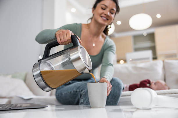 istock Young woman enjoying fresh coffee at home 1750103972