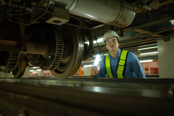 istock Engineers for electric trains After detecting difficulties with the electric train's machinery use searchlights to locate and check damaged sections. In the electric train repair shop 1750121598