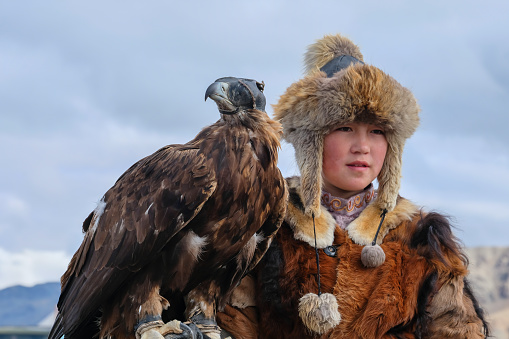 Eagle huntress winner of the Sagsai Golden Eagle Festival held on 17th-18th September 2023, near the small town of Sagsai, in the Bayan-Ulgii province of Western Mongolia. Set in the Altai Mountain range, the nomadic eagle hunters, dressed in traditional fur and embroidered clothing, gather to compete with their eagles, in various competitions that show the skill and bond between the hunter and their eagle.