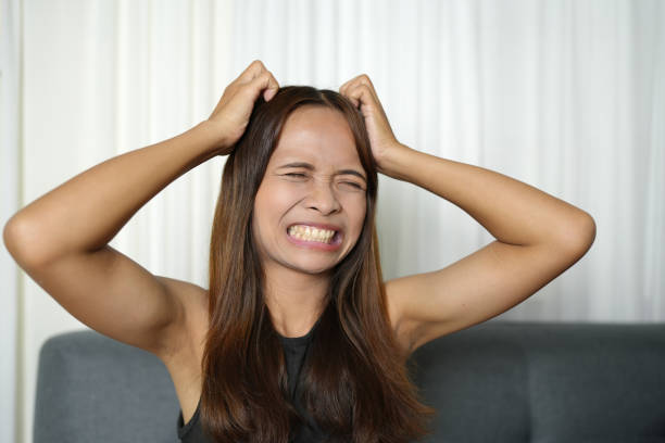 istock Asian woman has itchy scalp 1750149486