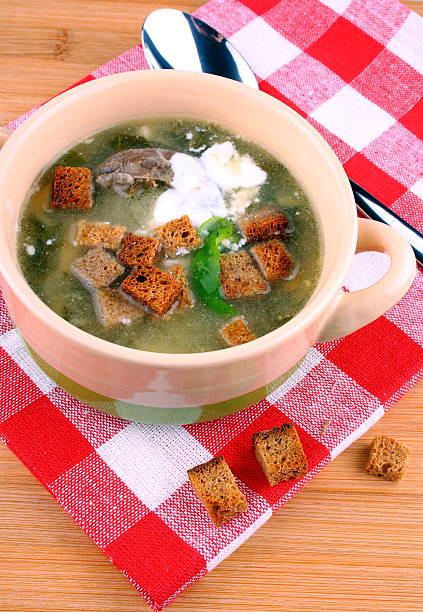 istock Green soup with meat, egg, cream and croutons 175015031