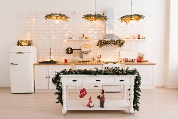 istock Christmas decor. Bright white kitchen interior with bright garlands and Christmas wreaths. 1750175272