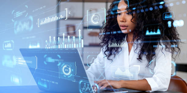istock African businesswoman using computer, graph chart and hologram with statistics 1750177597