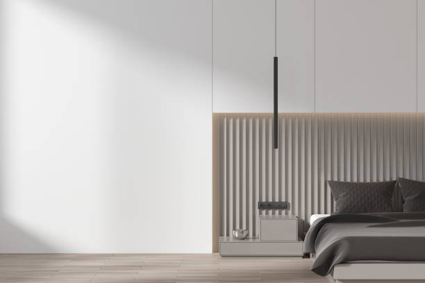 istock White and gray bedroom interior with blank wall 1750182917