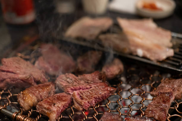 istock Korean Style Barbecue on stainless grill. BBQ rare meat with soft focus 1750183541