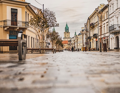 A crisp winter view of Lublin’s Old Town, devoid of snow but radiating a cold charm. The historic buildings, with their centuries-old architecture, stand against the stark winter sky, creating a serene and contemplative atmosphere that captures the soul of Lublin in the chill of winter.