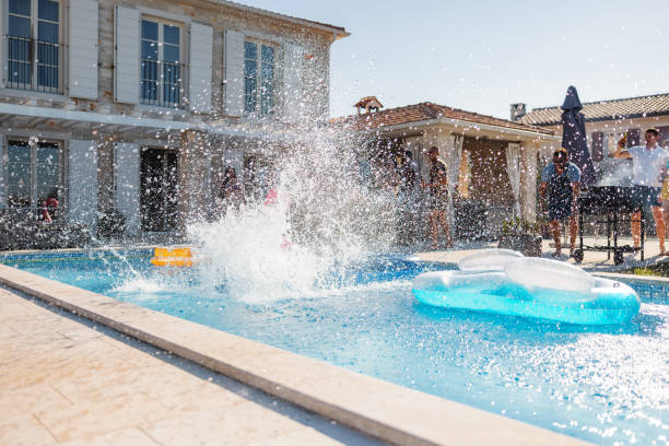istock A Person Jumping Into A Pool At A Pool Party And Splashing Everywhere 1750210887