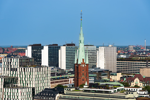 Stockholm, Sweden - September 10, 2023: Horizontal cityscape view of the church Klara with surrounding office buildings with sky and horizon in Stockholm Sweden September 10, 2023.