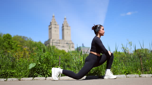 Multiracial girl jogging in Central Park