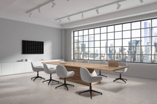 istock White office room interior with meeting table and chairs, panoramic window 1750217437