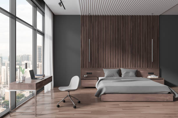 istock Grey home bedroom interior with bed and workplace, panoramic window 1750220282