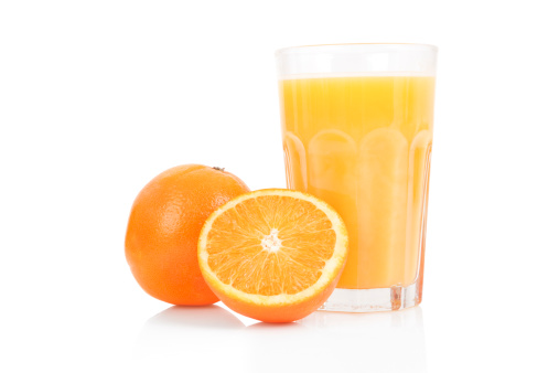 Yellow flesh navel orange fruits and juice in glass isolated on white background