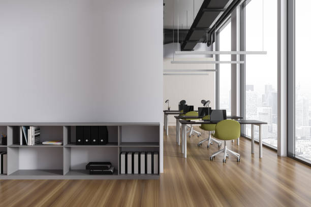 istock Modern coworking interior with table and chairs, shelf and window. Mock up wall 1750227141