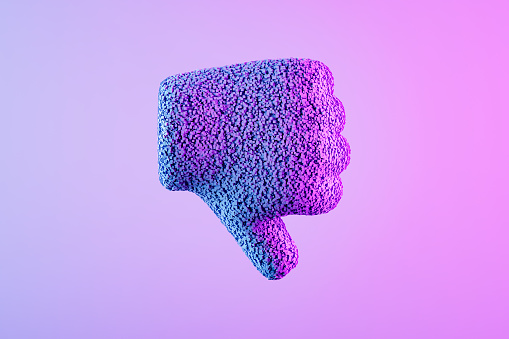 Thumbs down icon with particles on neon background. Digitally generated image.