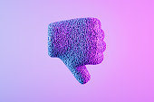 Thumbs down icon with particles on neon background