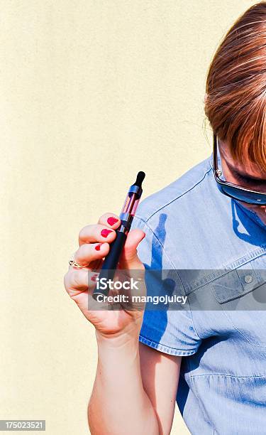 A Woman Using An Ecigarette Half In The Image Frame Stock Photo - Download Image Now