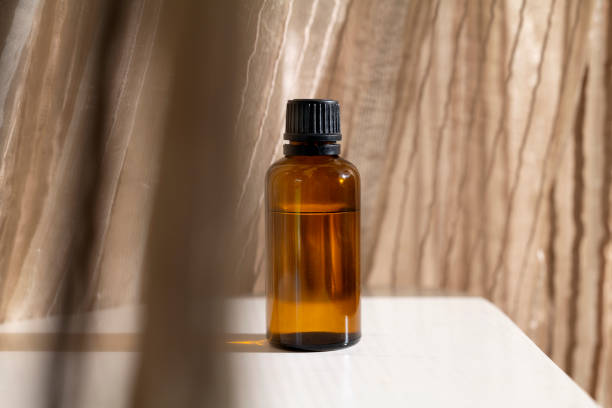 istock Mock-up Amber glass bottle with natural background 1750245648