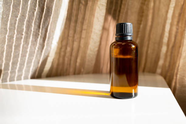 istock Mock-up Amber glass bottle with natural background 1750246228