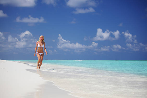 istock happy tropical girl run 175025283