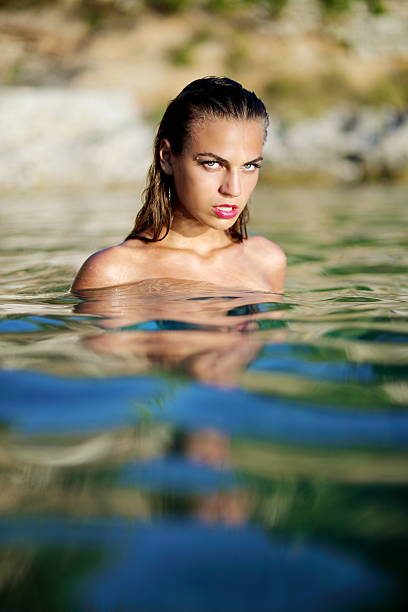 istock beautiful girl in sea 175025458