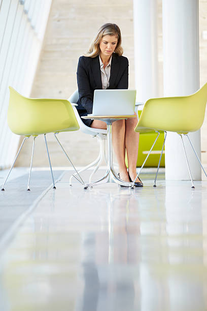 istock Businesswoman Working On Laptop At Table 175025472
