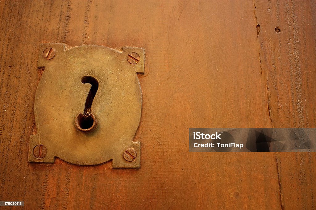 Old lock and question. Old lock and question. Spanish colonial style door. Cartagena de Indias, Colombia. Door Stock Photo