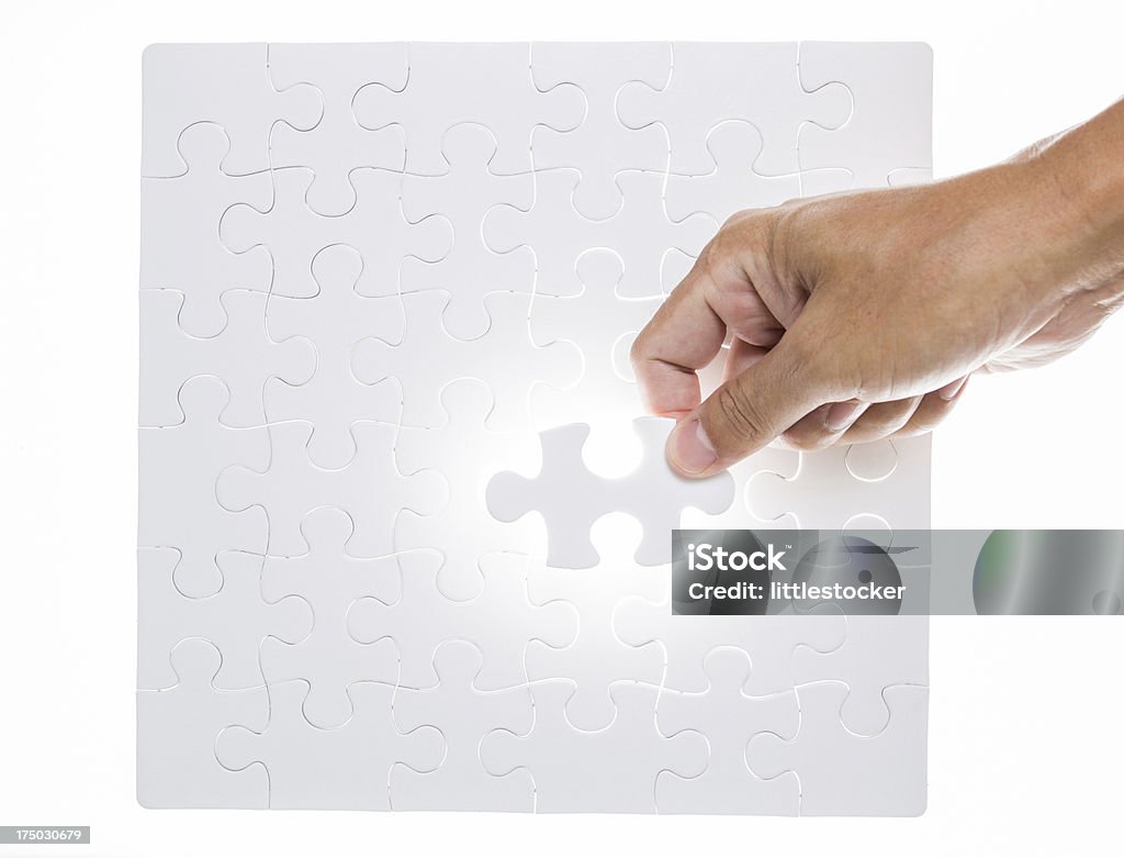Man hand holding jigsaw puzzle piece Absence Stock Photo