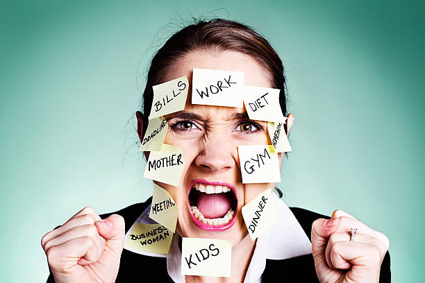 istock No more! Angry woman covered in task reminders rebels 175030848