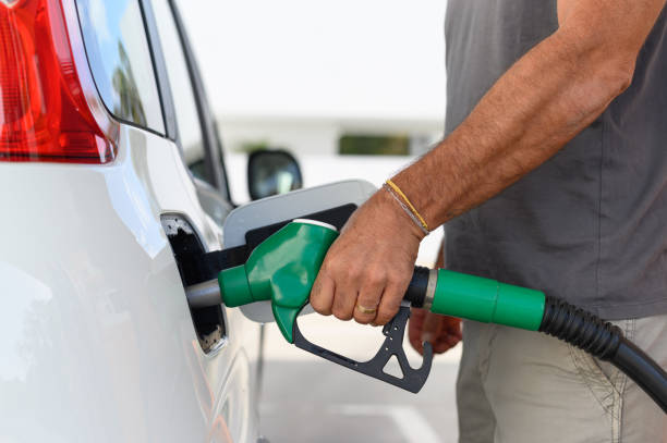 istock A man using a gas pump to refuel vehicle during energy crisis 1750319869