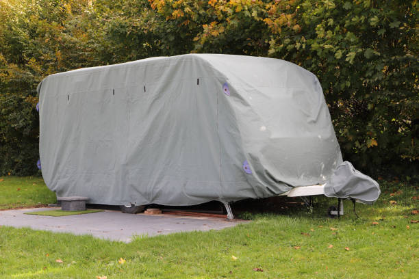 istock a caravan with a gray tarpaulin 1750321507