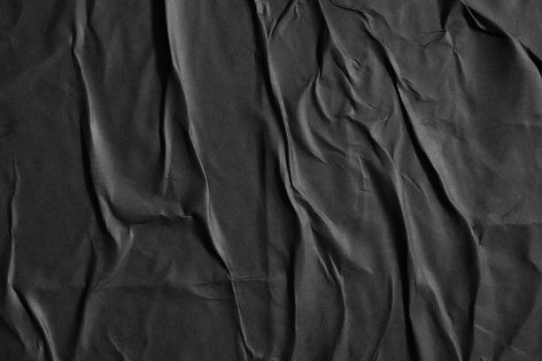 istock Glued black paper poster texture background 1750330980